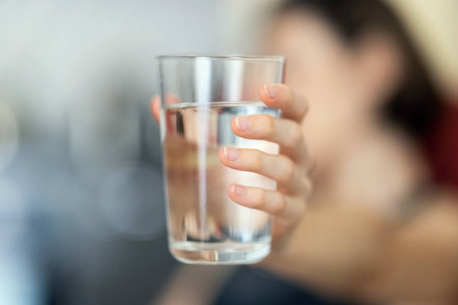 hand-holding-glass-of-water