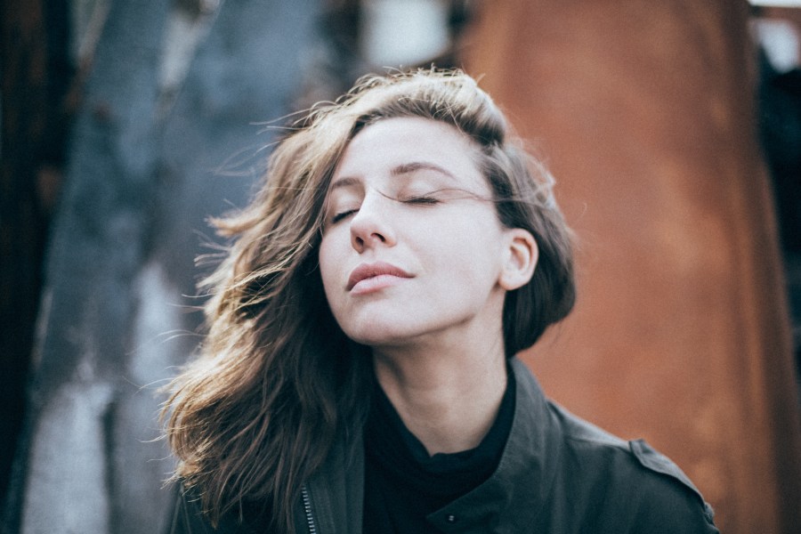 Woman taking a mindful and deep breath in